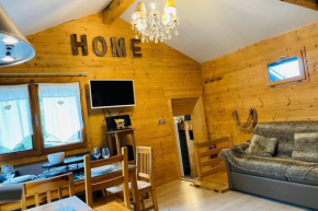 Bright little chalet with garden and view